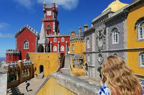 Marvel at the colorful Pena Palace in Sintra! This fairytale castle offers vibrant terraces and breathtaking views. A UN